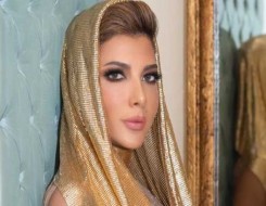   مصر اليوم - أفكار لفساتين راقية لوالدة العروس من وحي إطلالات أصالة